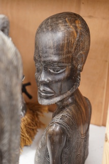 Two African tribal busts, two carved spoons and three carved Kamba Kenyan stools (11). Largest stool 28cm high. Condition - mostly good, some staining to seat of largest stool